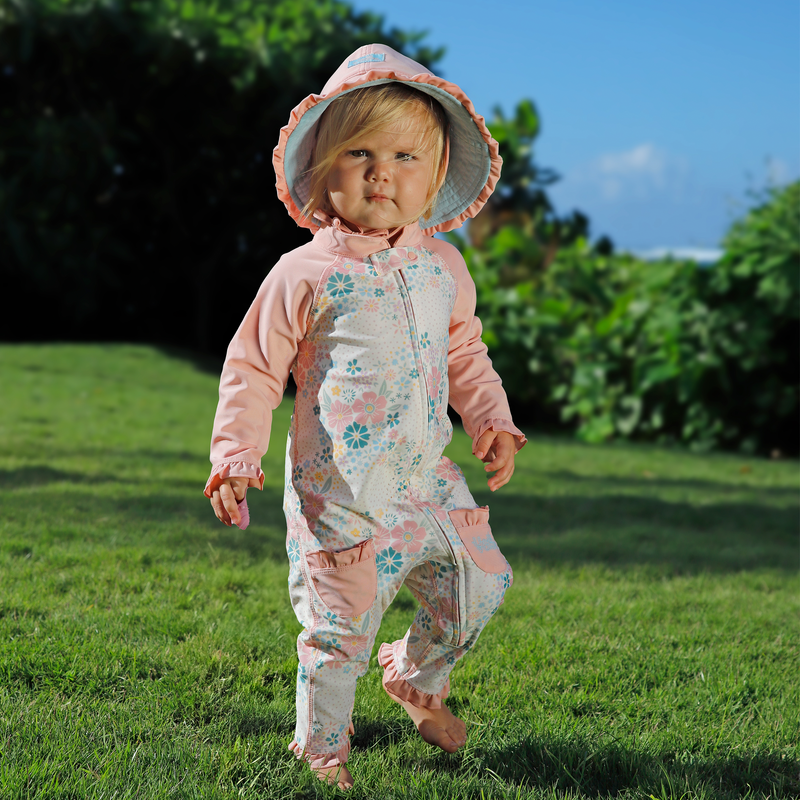 baby girl running in one piece sun & swim suit in secret garden|springtime-doodle