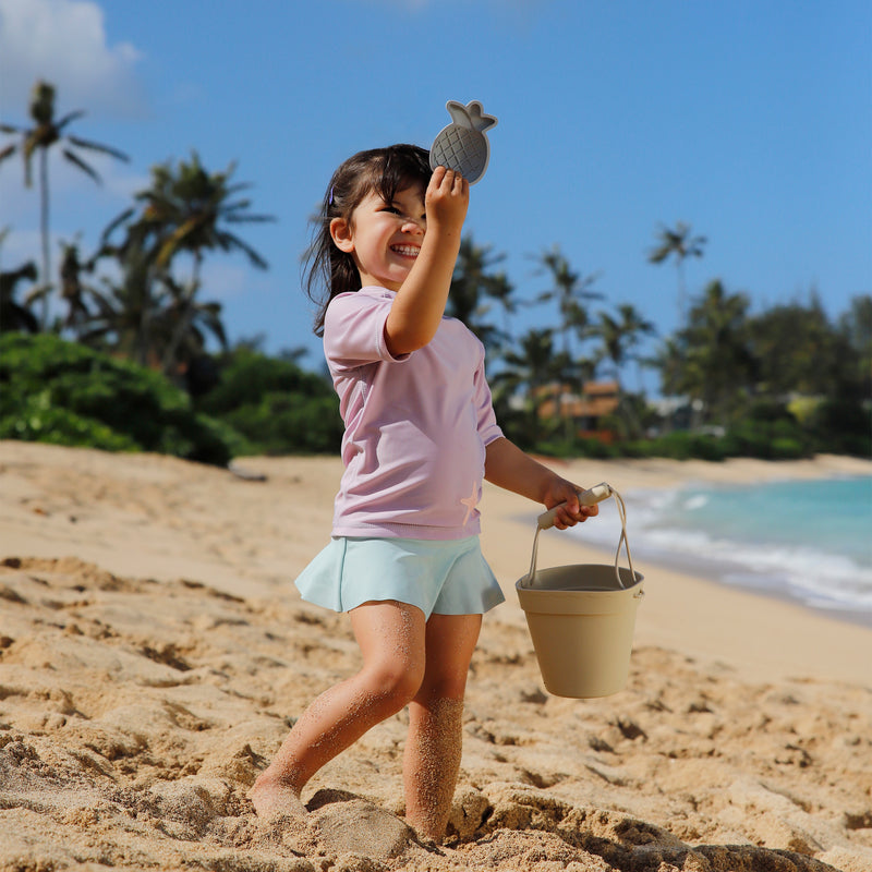 girl playing on the beach in flounce skirt in dewdrop|dewdrop