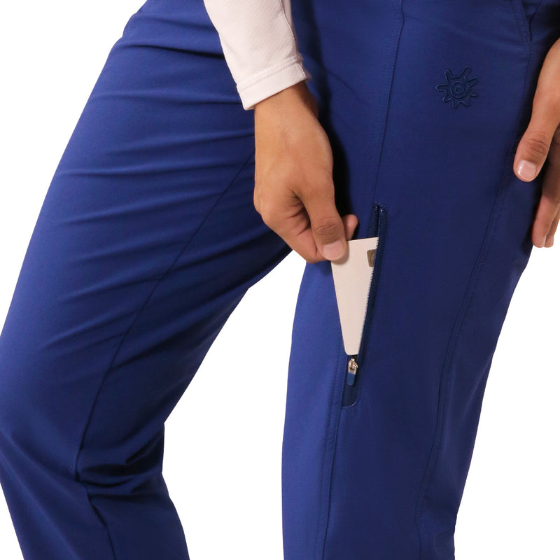 thigh pocket view close up of woman in walking capris in dark navy|dark-navy