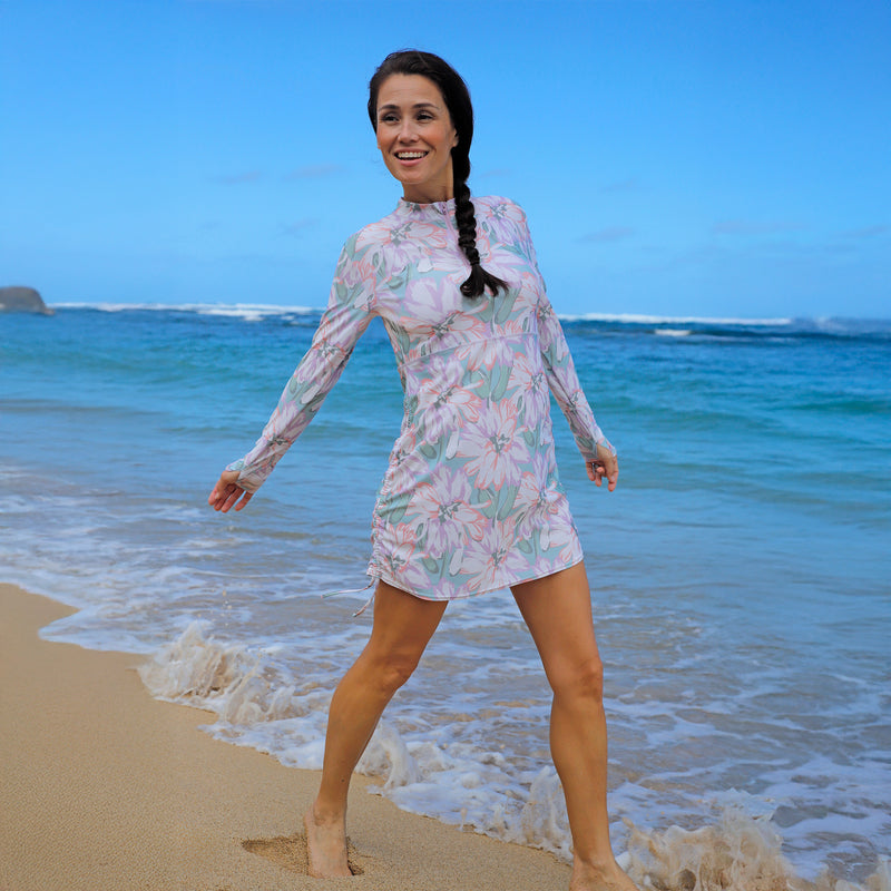 woman walking on the beach in convertible swim shirtdress in aurora bloom|aurora-bloom