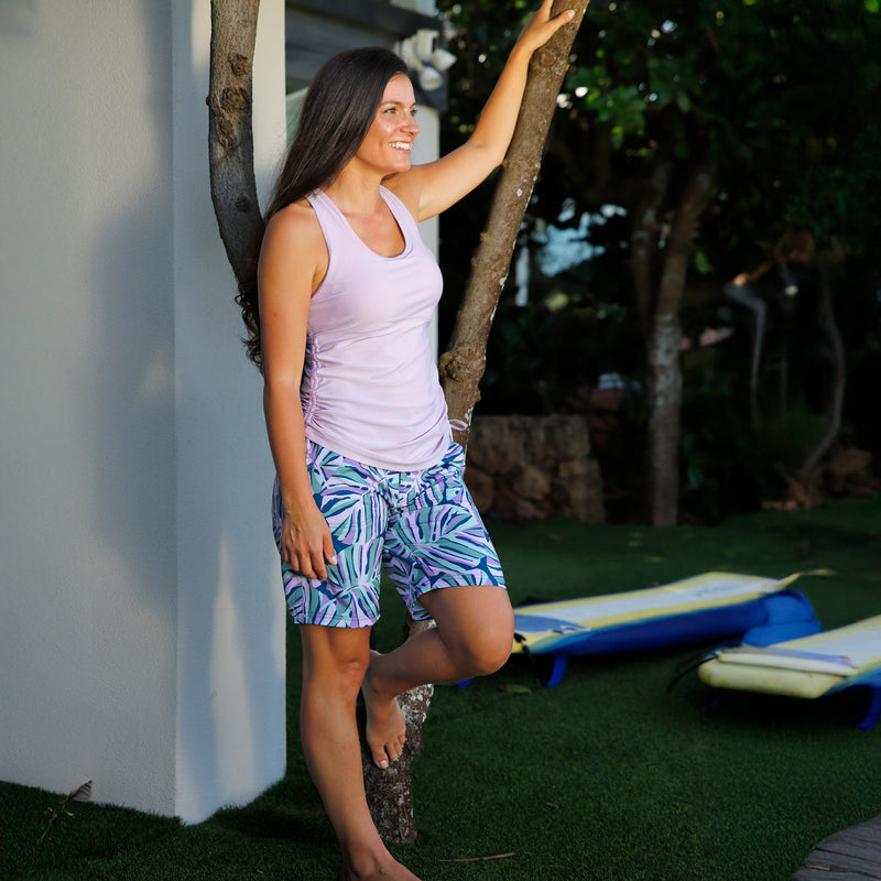 woman posing in women's ruched scoop tank top in lotus|lotus