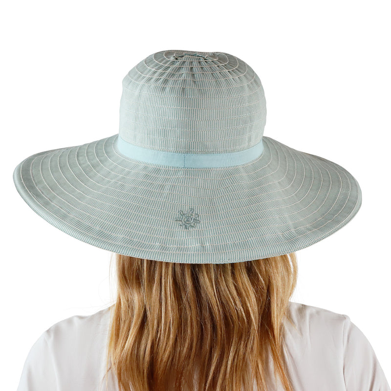 back view of woman in river pacifica hat|river