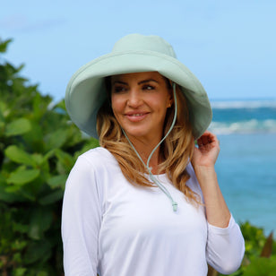 woman in women's roll up hat in dewdrop|dewdrop