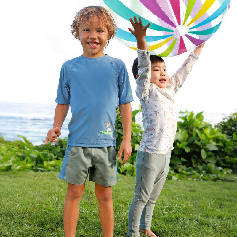 boy playing with friend in short sleeve crew sunny swim shirt in paddle board pup|paddle-board-pup