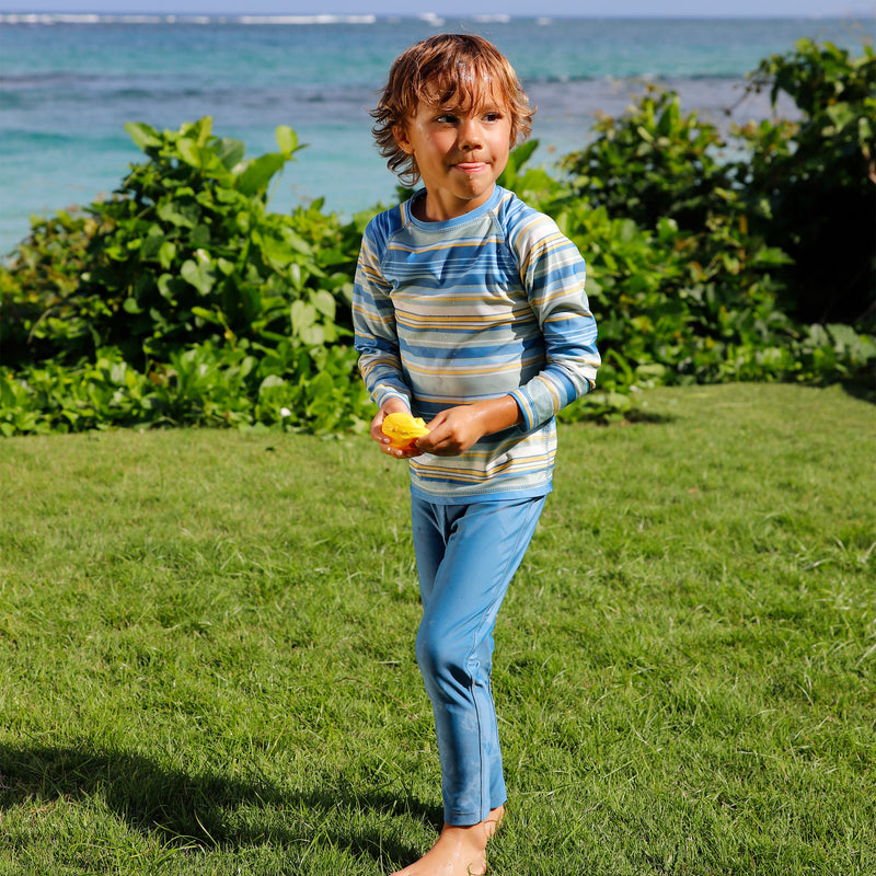 boy in grass in boy sun leggingz in baltic|baltic